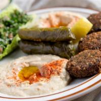 Mvp Veggie Sampler · Top sellers. Hummus, baba, tabouleh salad, 3 dolma, and 3 falafel. Served with two arabic pi...