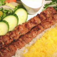Beef Koobideh Kabob Plate · Ground Seasoned Beef Kabobs Served w/ Basmati Rice, Side Salad, Fresh Pita & Your Choice of ...