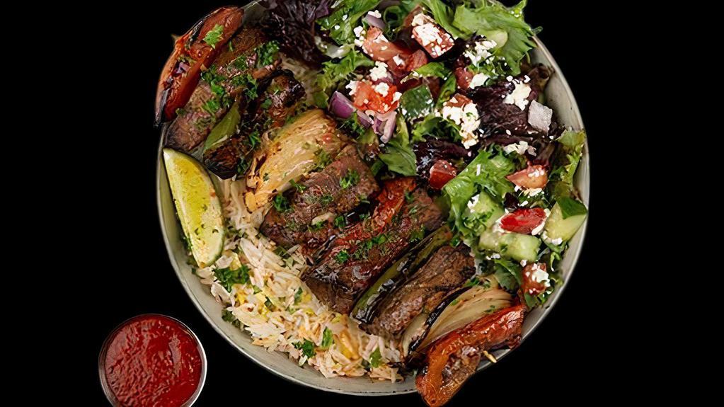 Beef Shawarma Plate · Tender Beef Shawarma Served w/ Basmati Rice, Side Salad, Fresh Pita & Your Choice of Sauce.
