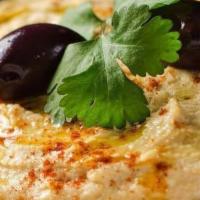 Hummus Plate · Crushed Chickpeas, Tahini Paste & House Special Seasoning. Served w/ Fresh Pita.