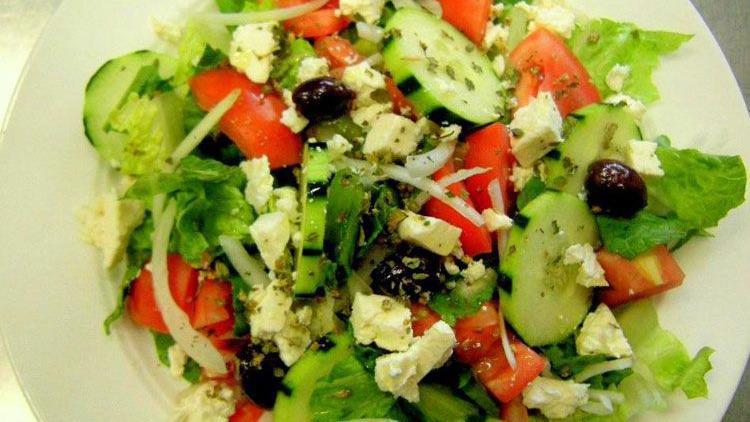 Greek Salad · Mixed Greens Served w/ Cucumber, Onions, Tomato, Olives, & Feta Cheese.