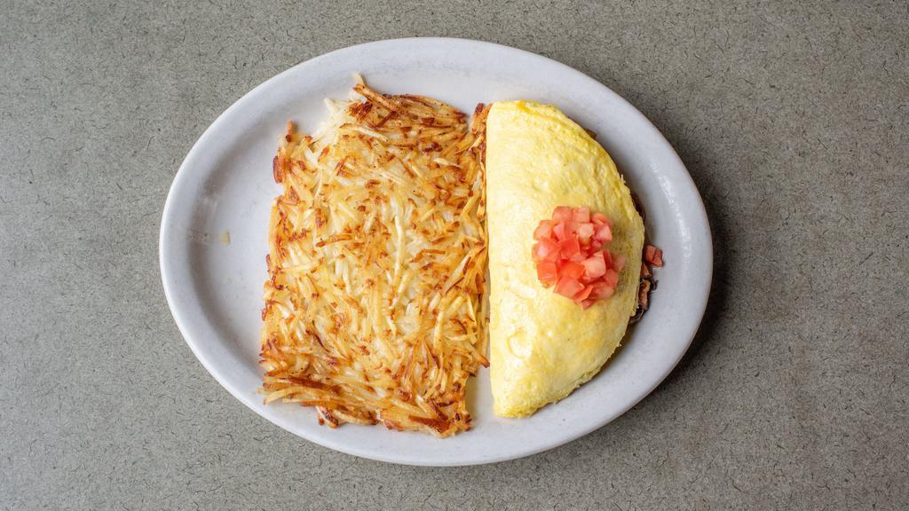 Farmer'S Favorite Omelet · All the meats! Italian sausage, ham & bacon with mushrooms, onions & cheddar topped with diced tomatoes.