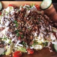 *Carne Asada Wedge Salad · Our take on the wedge salad comes with carne asada, seasonal vegetables, cotija cheese, hous...
