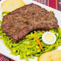 Tallarin Verde Con Bistek · Pesto spaghetti pasta with thin steak.