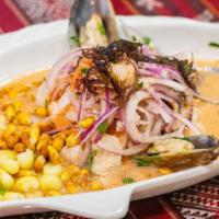 Ceviche Mixto · Fresh white fish, octopus and squid marinated in lime juice. Served with yams, potato, onion...