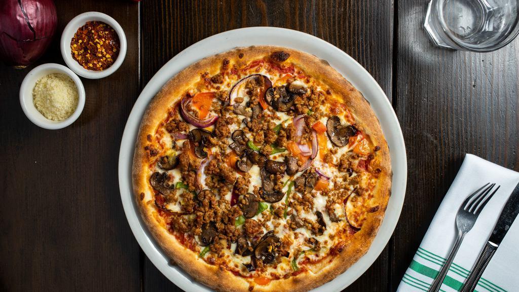 Meet The Vegan Meats Club · Our famous vegan meat pizza is topped on our homemade pizza with vegan cheese, vegan sausage, vegan beef, vegan pepperoni, and special seasoning.