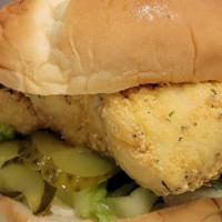 Halibut Fish Sammich & Fries · Chef Woe's Fresh Deep Fried Halibut seasoned to perfection on a pub style bun with lettuce,p...