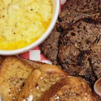 Ribeye Steak N French Toast With Cheese Eggs · 2 Thin Sliced Grilled Ribeye steaks served with French toast and Eggs.