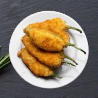 Jalapeno Poppers · (8 pcs.)  Jalapeno, cream cheese, and crab with white sauce, sweet sauce and hot sauce.