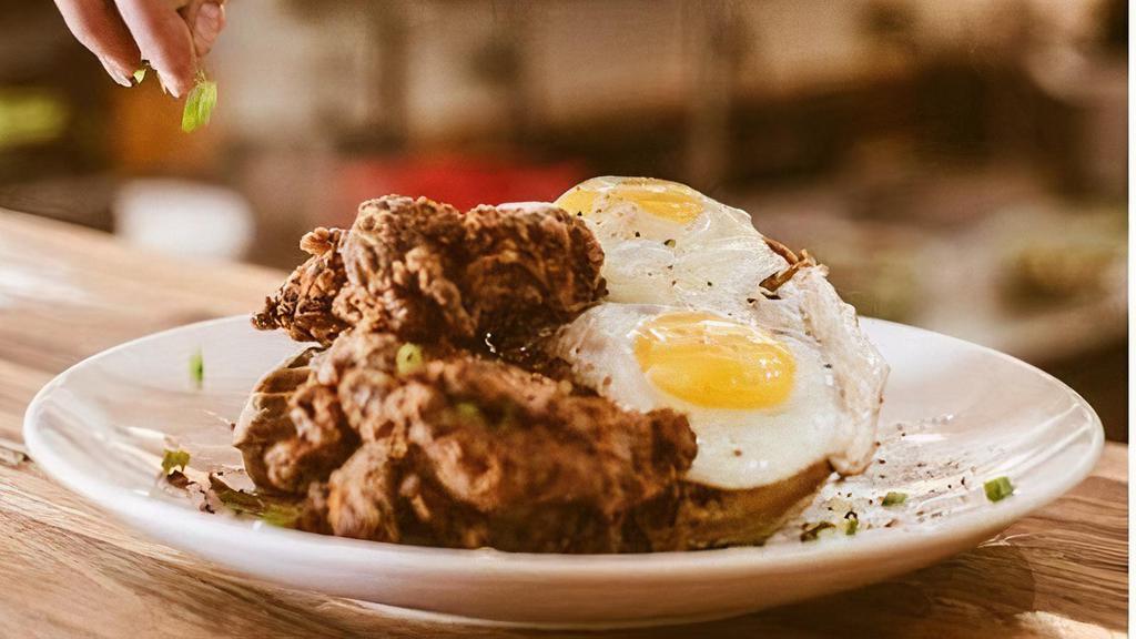 Southern Comfort To Go · house blue cornmeal waffle, buttermilk . fried chicken & two eggs, served . w/ a side of bourbon maple syrup