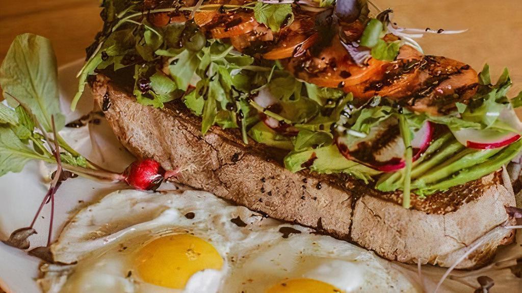 Avocado Smash To Go · avocado on rustic toast with sliced  . radish, tomatoes & microgreens,  . served with two fried eggs
