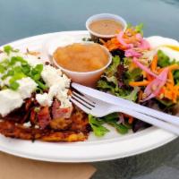 The Charlotte · 2 latkes topped with bacon, caramelized onions and goat cheese. Served with soup or salad.