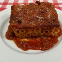 Sicilian Anelletti · Baked Anelletti, Meat Sauce, Mozzarella, Ham
