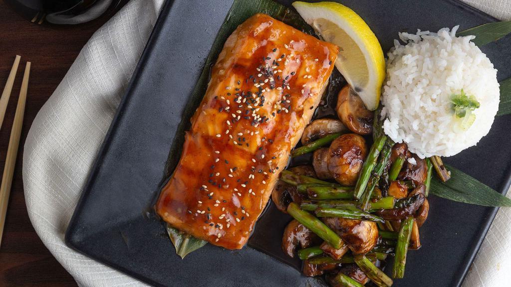 Miso Glazed Salmon · Fresh line caught salmon fillet topped with a red miso and ginger glaze topped with fresh basil and a lemon served with asparagus, rice and mushrooms.