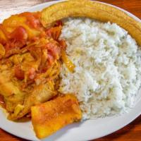 Arroz Con Pollo · Yellow rice mixed with vegetables and chicken. Served with green salad.