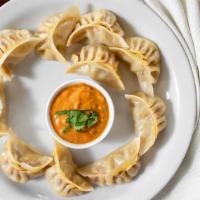Momos · Dairy free. Authentic homemade Nepalese dumplings filled with your choice of chicken or vege...