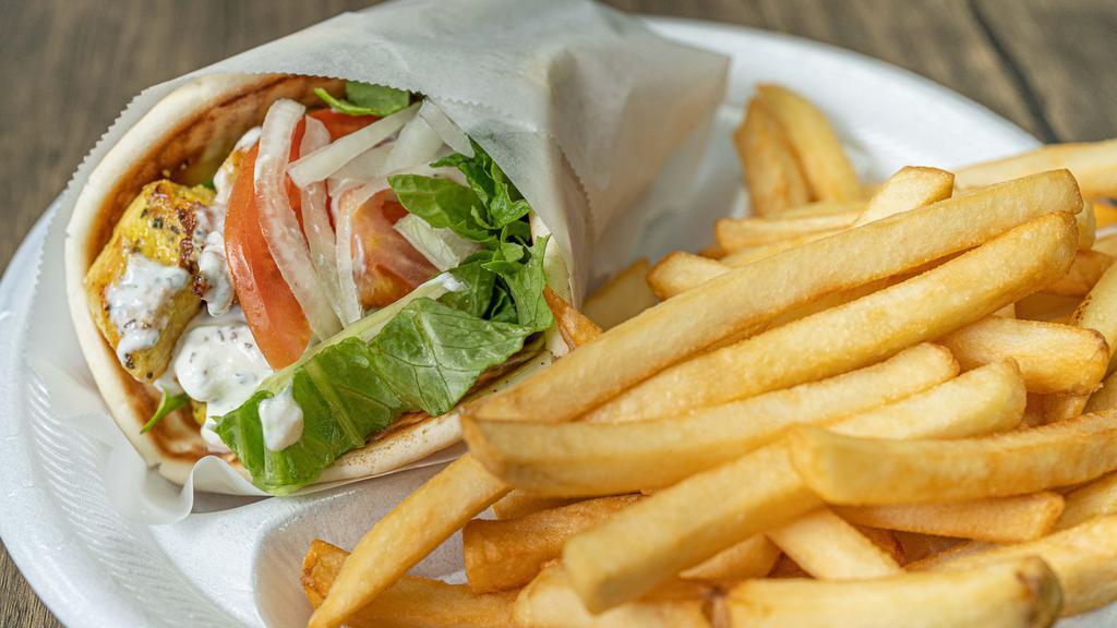 Chicken Gyro · Non-vegetarian. Lettuce, tomato, onion, and tzatziki sauce wrapped in pita bread. Served with lemon rice, fries, or Greek salad.