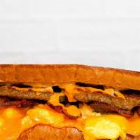 Texas Toast, Bacon, Sausage, Egg, And Cheese · 2 fresh cracked cage-free scrambled eggs, melted American cheese, bacon, sausage,  and Srira...