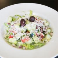 Greek Salad · Lettuce with tomatoes, onions, feta cheese, cucumbers, greek olives, and house dressing.