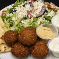 Falafel Salad · Lettuce with falafel (chickpea patties), tahini (sesame paste), tomatoes, onions, feta chees...