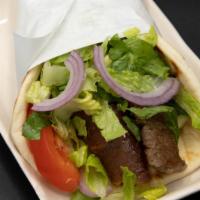 Gyro Sandwich · With sliced spit-roasted beef, tomatoes, onions, and tzatziki (cucumber-yogurt sauce) served...