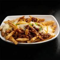Chili Cheese Fries · Fries topped with beef chili, cheese sauce, and shredded cheddar