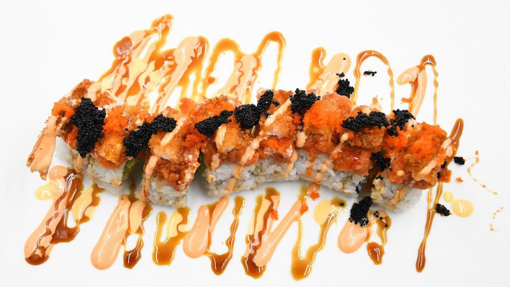 Rock Star · Contains gluten and contains raw item. Seaweed, krab mix, avocado and cucumber topped with spicy tuna, shrimp tempura, tobiko, masago, spicy mayo, unagi and mango sauce.