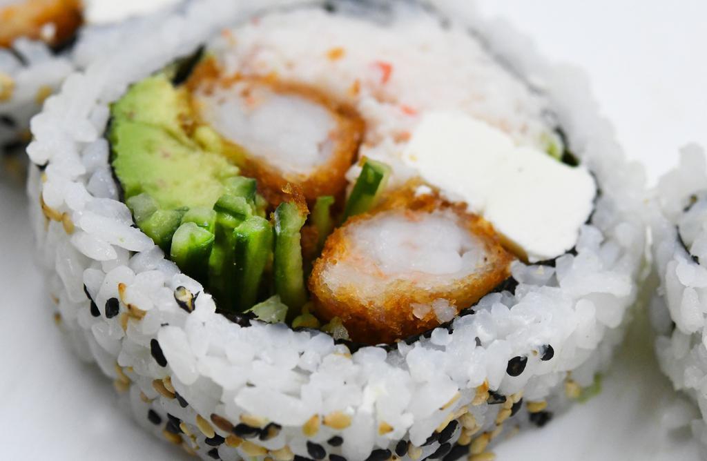 Sumo · Contains gluten. Rolled futomaki style. Seaweed, shrimp tempura, krab mix, avocado, cucumber and cream cheese.