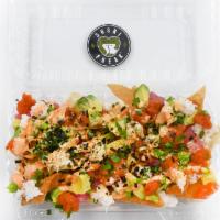 Poké Nachos · Contains gluten, contains raw item. Crispy wonton chips topped with tuna and salmon poké, sp...