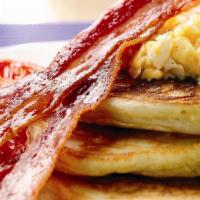 2 Pancakes With 2 Strips Of Bacon · Pancake combo.