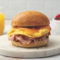 Ham, Egg, And Cheese · Crafted with Tenderbelly ham, scrambled eggs, and cheddar cheese on a brioche bun.
