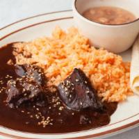 Chicken Mole · One of Mexico’s more traditional plates, mole is made with a variety of 4 chiles, chocolate ...