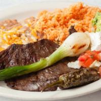 Carne Asada · Charbroiled sirloin steak served with beans, rice, guacamole and roasted jalapeño, choice of...