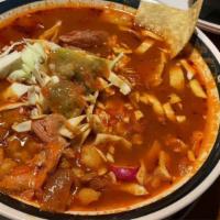 Pozole · A traditional soup made with Pork,
Hominy and different spices, served with
Cabbage, Radish ...