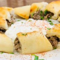 Kafta Meat Pies · 2 pies. Fresh filo dough filled with ground beef and parsley mixed with Lebanese spices.