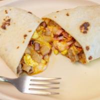 Smothered Breakfast Burrito · Potatoes, eggs, cheese smothered with pork green chili in a flour tortilla