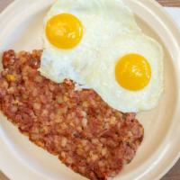 Corned Beef Hash · Corned beef hash with two eggs and toast.