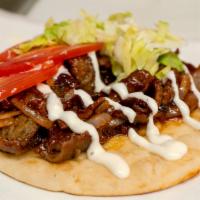 Western Bbq Gyro · Gyro meat glazed and seared with our sweet and savory barbecue sauce topped with grilled oni...