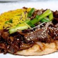 Mongolian Gyro  · Gyro meat simmered with our sweet  and savory honey sesame sauce. Topped with grilled onions...