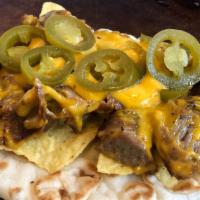 Nacho Cheese Gyro · Try the new Nacho cheese gyro! Gyro topped with nacho cheese, tortilla chips, and spicy jala...