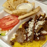 Classic Gyro Rice Platter · Classic Gyro meat on yellow rice. Includes tomato, onions, cucumber, feta, tzatziki sauce, a...