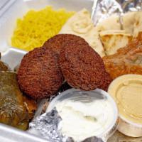 Veggie Platter · Includes four falafels, four dolmas, one spanakopita, side of rice, pita bread, hummus and t...