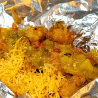 Green Chili Tot-Box · Tater tots smothered in Pueblo Green chili and cheddar cheese.