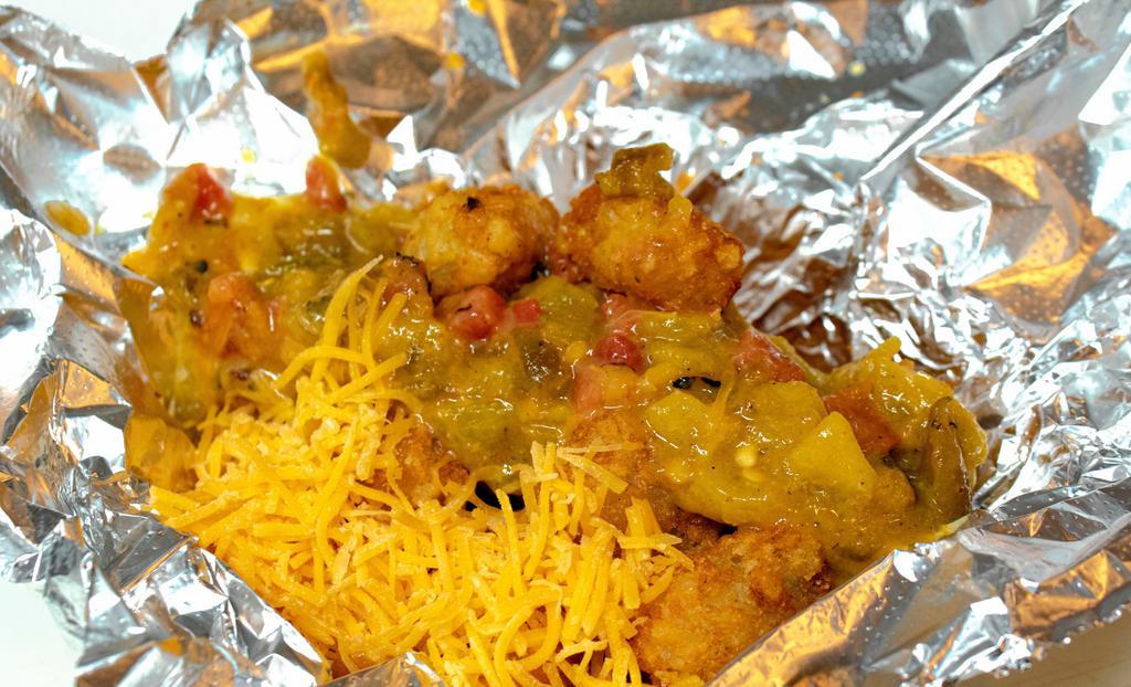 Green Chili Tot-Box · Tater tots smothered in Pueblo Green chili and cheddar cheese.