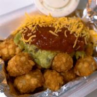 California Tot-Box · Tater tots topped with guacamole, cheddar cheese, tzatziki sauce and a side of red hot sauce.