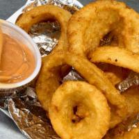 Cowboy Onion Rings · Crisp golden fried battered onion rings. Includes a side of Cowboy sauce--a spicy BBQ mayo b...