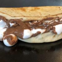 S'Mores Pita · Nutella spread over a hot pita bread topped with melted marshmallows! This dessert is truly ...