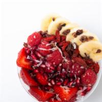 Lotus Bowl · Strawberries, banana, raspberries, pomegranate, coconut flakes, white chocolate chips, goji ...