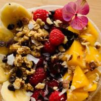 Buda Bowl · Mangos, raspberries, bananas, coconut flakes, chocolate chips, topped with honey drizzle.