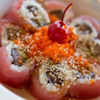 * Cherry Blossom · Spicy. Inside: Salmon, Avocado. Topped w/ Tuna, Masago, Creamy
Ponzu.

These foods are serve...